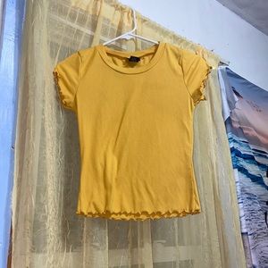 yellow tight fitted shirt with ribbed edges